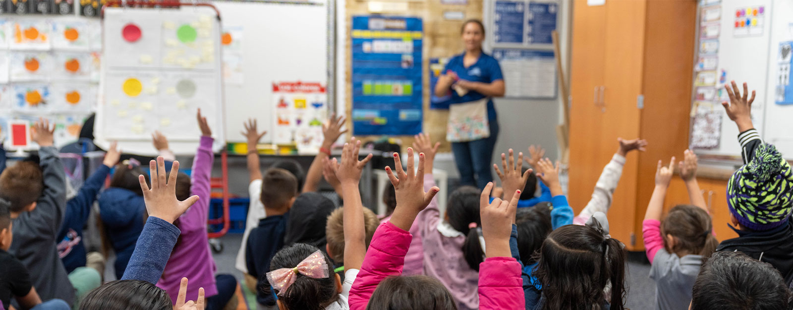 Students Rising Their Hands in Class 